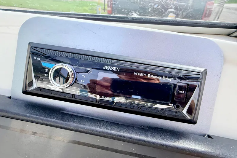 Slide: The Image of Jensen MPR2121 stereo in a 1994 Skeeter SS140 boat dashboard. - 48