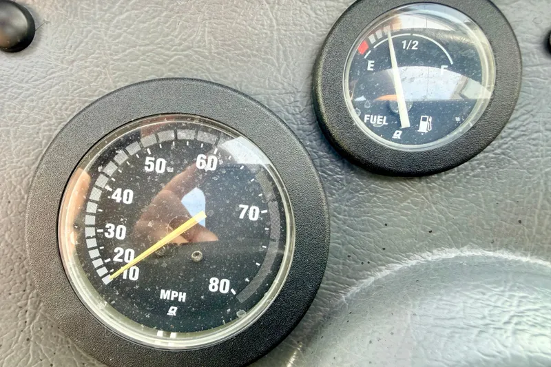 Slide: The Image of Dashboard of a 1994 Skeeter SS140 showing speedometer and fuel gauge. - 43