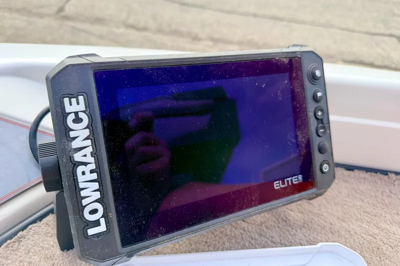 Slide: The Image of Lowrance Elite fish finder on 1994 Skeeter SS140 boat dashboard. - 64