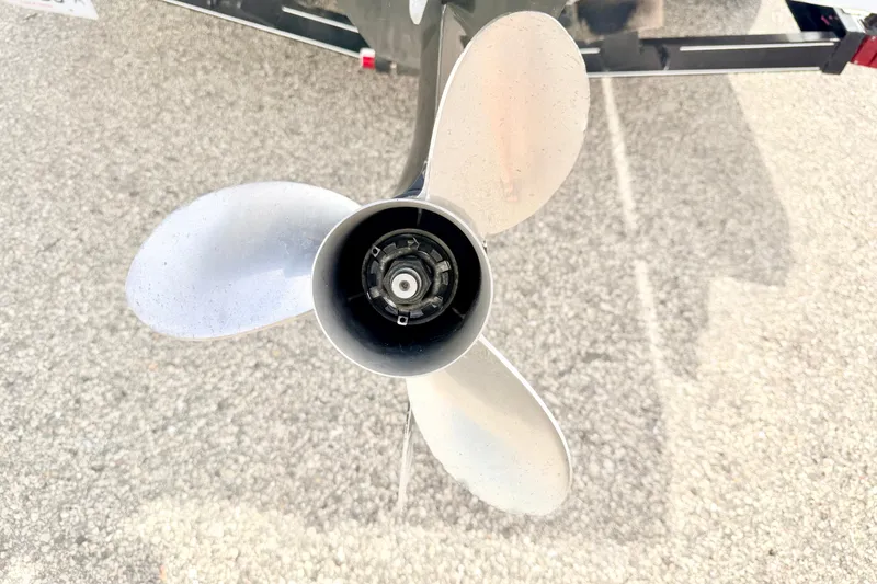 Slide: The Image of Propeller of a 1994 Skeeter SS140 boat on a gravel surface. - 21