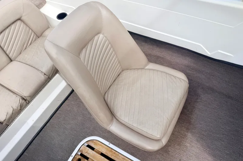 Slide: The Image of Beige leather seat in a 1994 Skeeter SS140 boat interior. - 50