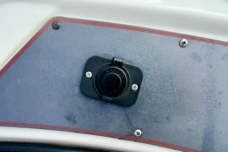 Slide: The Image of Fuel cap on 1994 Skeeter SS140 boat deck, secured with screws. - 62