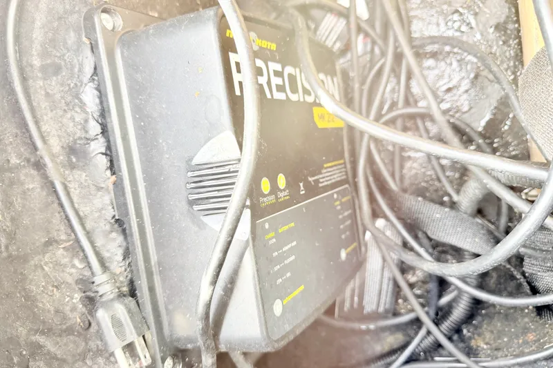 Slide: The Image of Battery charger with cables in a 1994 Skeeter SS140 boat. - 34