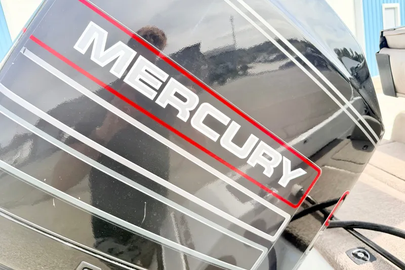 Slide: The Image of 1994 Skeeter SS140 boat with Mercury engine, close-up view. - 23