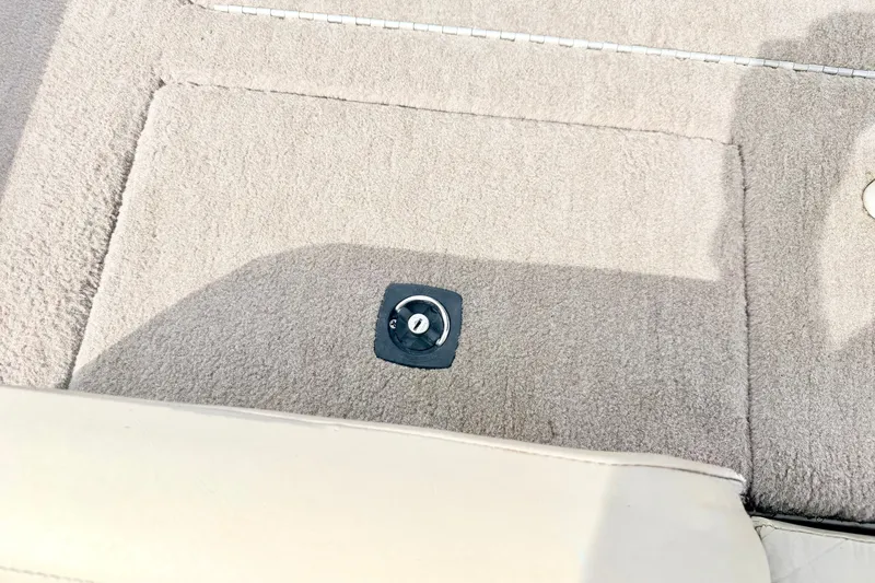 Slide: The Image of Carpeted interior of a 1994 Skeeter SS140 boat with a mounted fixture. - 30