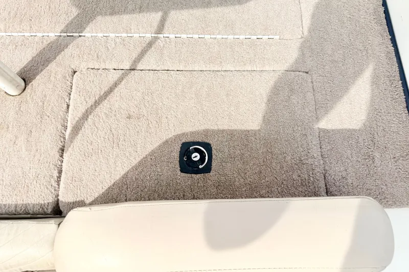 Slide: The Image of Carpeted deck of a 1994 Skeeter SS140 boat with a seat mount. - 28