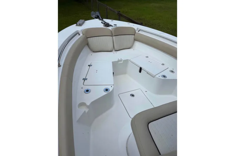 Slide: The Image of 2016 Sea Fox 246 Commander boat interior with cushioned seating and storage compartments. - 7