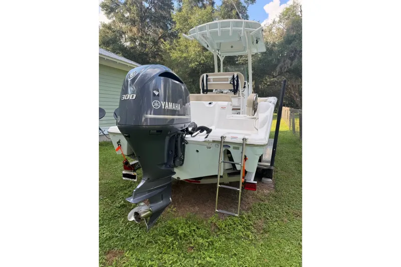 Slide: The Image of 2016 Sea Fox 246 Commander boat with Yamaha 300 engine, parked on grass. - 8