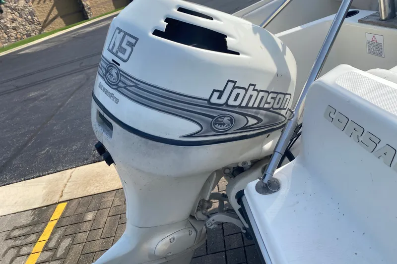 Slide: The Image of Outboard motor on a 1994 Sunbird Corsair 170 boat, featuring Johnson branding. - 10