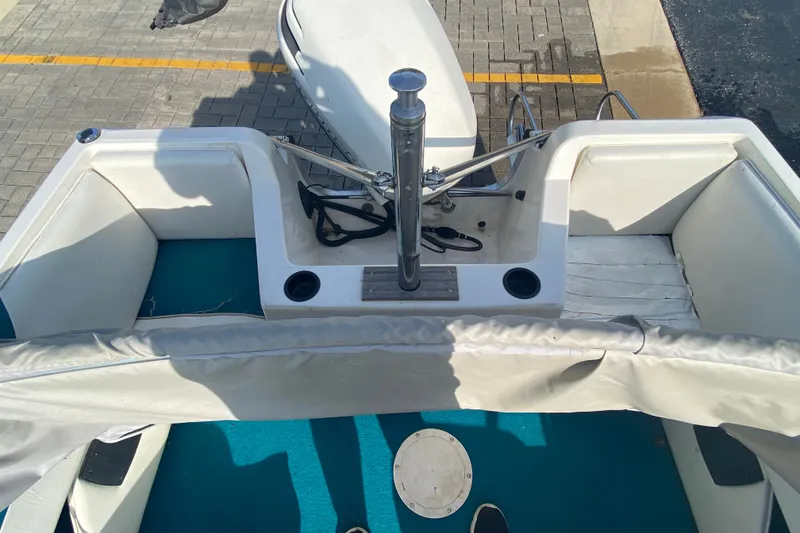 Slide: The Image of 1994 Sunbird Corsair 170 boat interior with seating and storage compartments. - 5