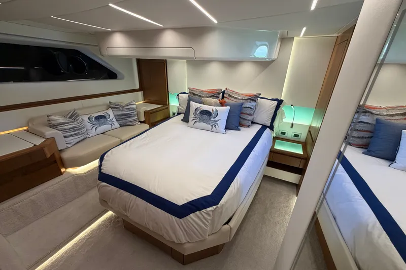 Slide: The Image of Luxurious bedroom interior of 2026 Tiara Yachts EX 54, featuring elegant bedding and ambient lighting. - 20