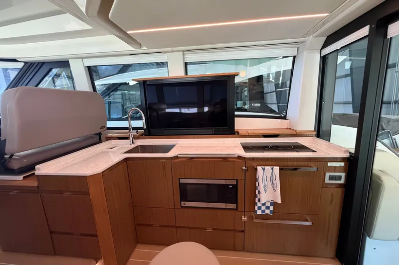 Slide: The Image of Luxurious kitchen interior of 2026 Tiara Yachts EX 54 with modern appliances and sleek design. - 29