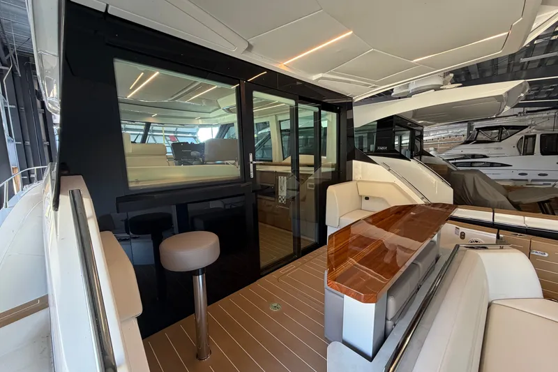 Slide: The Image of 2026 Tiara Yachts EX 54 interior with sleek design and luxurious seating. - 38