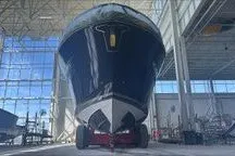 Slide: The Image of 2026 Tiara Yachts EX 54 in a spacious indoor facility, showcasing its sleek design. - 3