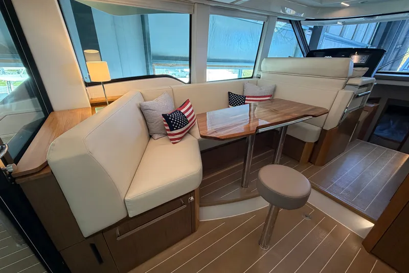 Slide: The Image of Luxurious interior of 2026 Tiara Yachts EX 54 with elegant seating and wooden table. - 30