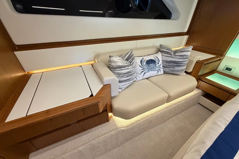 Slide: The Image of Luxurious interior of 2026 Tiara Yachts EX 54 with elegant seating and decorative pillows. - 21