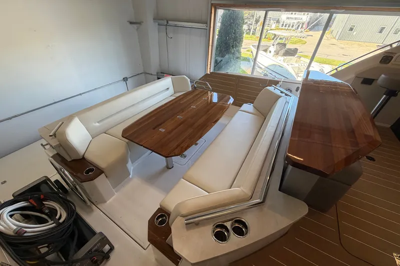 Slide: The Image of Luxurious interior of 2026 Tiara Yachts EX 54 with elegant seating and wooden table. - 36
