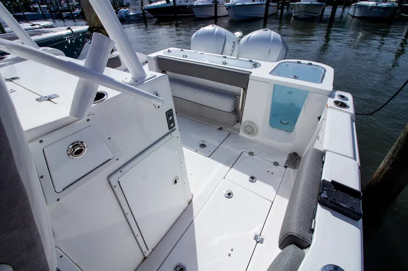 Slide: The Image of The image shows the cockpit of a 2019 Sea Fox 328 Commander with gray upholstery. - 30