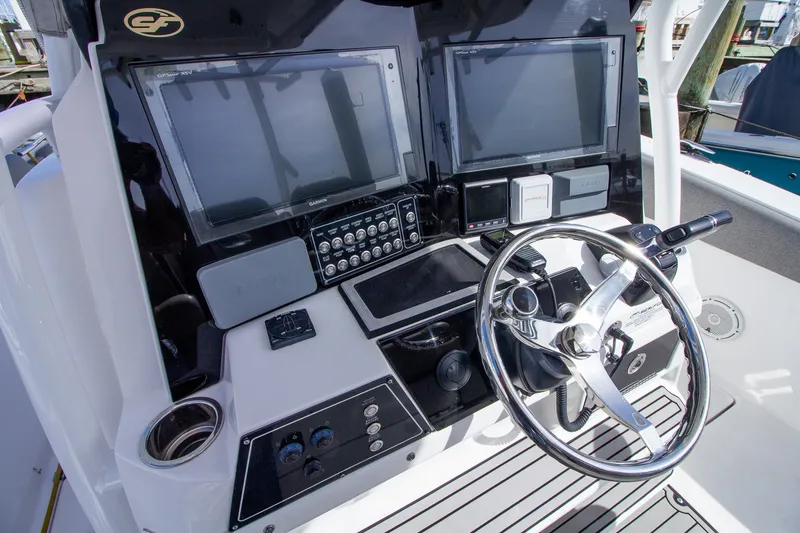 Slide: The Image of The image shows the helm of a 2019 Sea Fox 328 Commander with two large screens. - 21