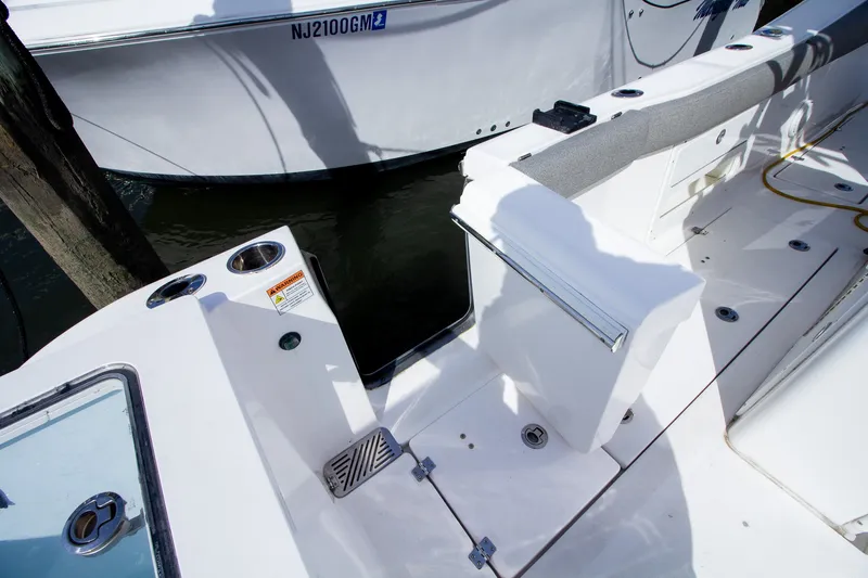 Slide: The Image of The image shows the deck of a 2019 Sea Fox 328 Commander with fishing rod holders. - 31