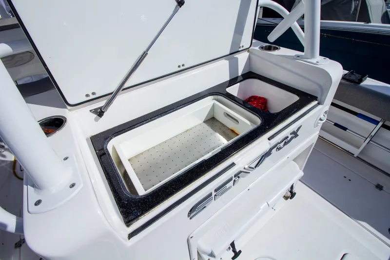 Slide: The Image of 2019 Sea Fox 328 Commander: Storage compartment with open lid and integrated bin. - 39
