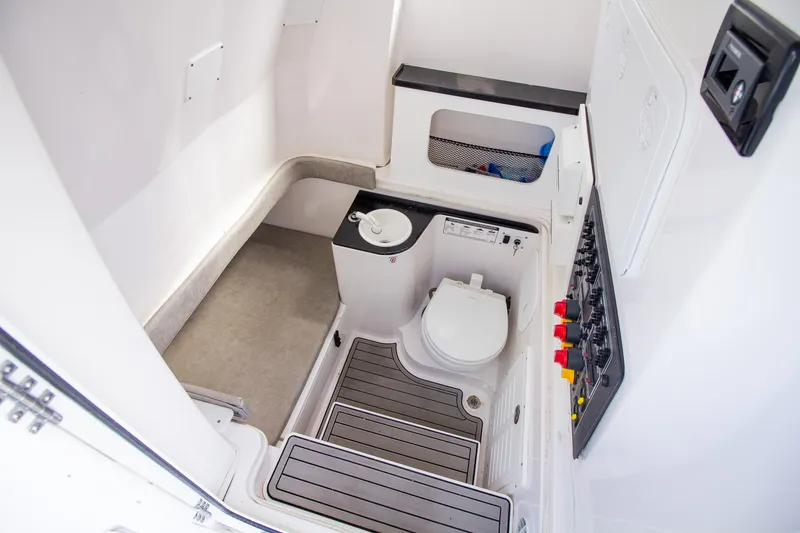 Slide: The Image of Interior view of a boat cabin with a toilet and control panel. - 13