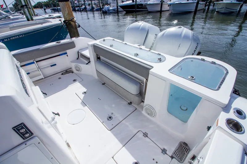 Slide: The Image of The image shows the cockpit of a 2019 Sea Fox 328 Commander with dual engines. - 32
