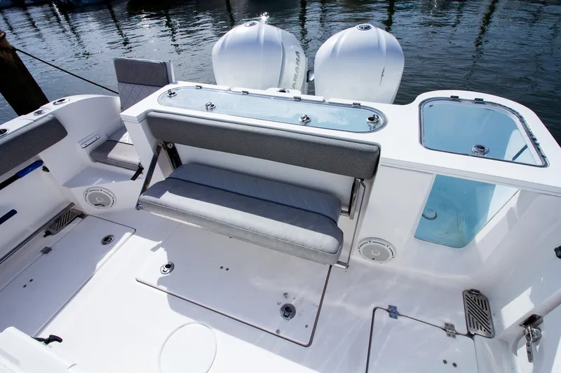 Slide: The Image of The image shows the stern of a Sea Fox 328 Commander with twin engines and a bench seat. - 41