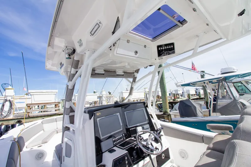 Slide: The Image of The image shows the cockpit of a 2019 Sea Fox 328 Commander with modern electronics. - 20