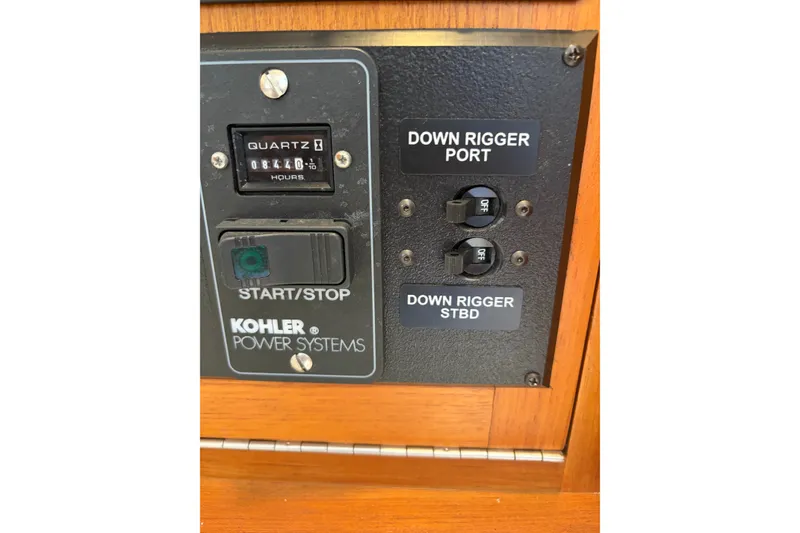 Slide: The Image of Control panel of a 2005 Cabo 35 Express boat with Kohler power system. - 36
