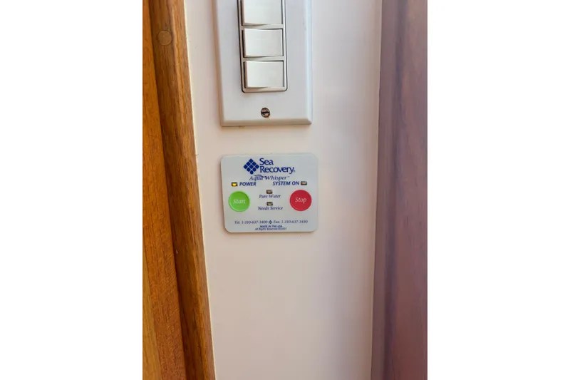 Slide: The Image of Control panel for Sea Recovery Aqua Whisper system on a 2005 Cabo 35 Express boat. - 33