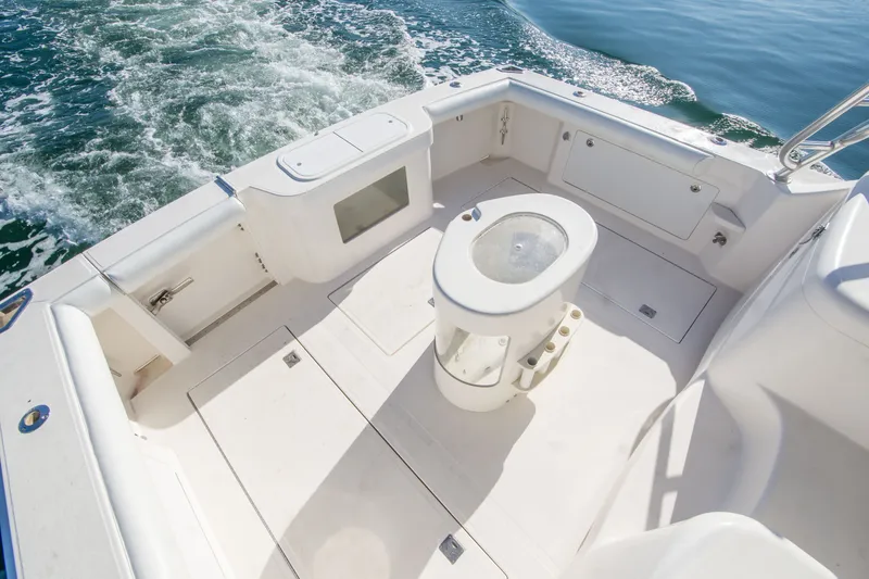 Slide: The Image of 2005 Cabo 35 Express boat deck with seating and ocean view. - 8