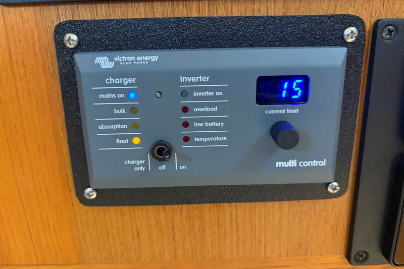Slide: The Image of Victron Energy control panel on 2005 Cabo 35 Express boat, displaying current limit. - 34