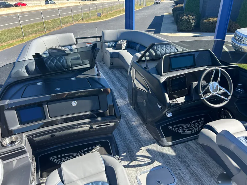 Slide: The Image of Luxurious pontoon boat with sleek gray seating and modern cockpit, perfect for comfortable cruising. - 16