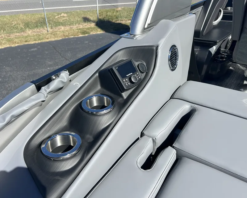 Slide: The Image of The image shows a luxurious seating area on a boat with cup holders and a control panel. - 10