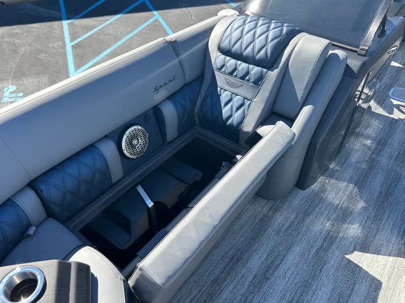 Slide: The Image of Luxurious seating area with blue and gray upholstery on a Bennington 27QXSB boat. - 35