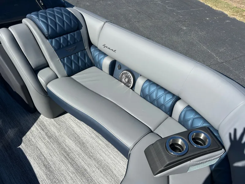 Slide: The Image of Luxurious gray and blue bench seat with quilted pattern and cup holders on a boat. - 31