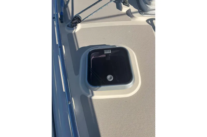 Slide: The Image of Deck hatch on a 2002 Island Packet 350 sailboat, featuring a secure latch. - 17