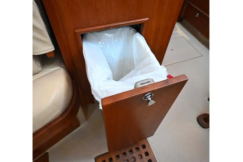 Slide: The Image of Pull-out trash bin in 2002 Island Packet 350 yacht interior. - 54