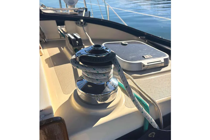 Slide: The Image of Winch on 2002 Island Packet 350 sailboat deck with ropes and hatch. - 10