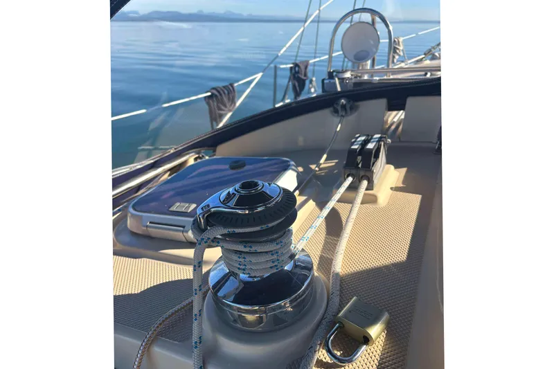 Slide: The Image of Deck view of a 2002 Island Packet 350 sailboat with winch and ropes. - 9