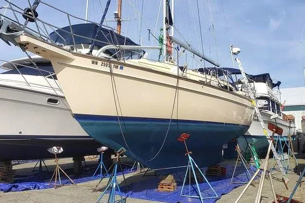 Slide: The Image of 2002 Island Packet 350 sailboat on stands in a boatyard. - 3