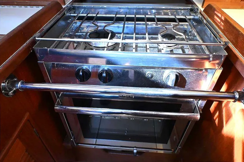 Slide: The Image of Stainless steel stove and oven in 2002 Island Packet 350 yacht galley. - 58