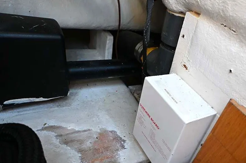 Slide: The Image of Electrical components and wiring inside a 2002 Island Packet 350 sailboat. - 91