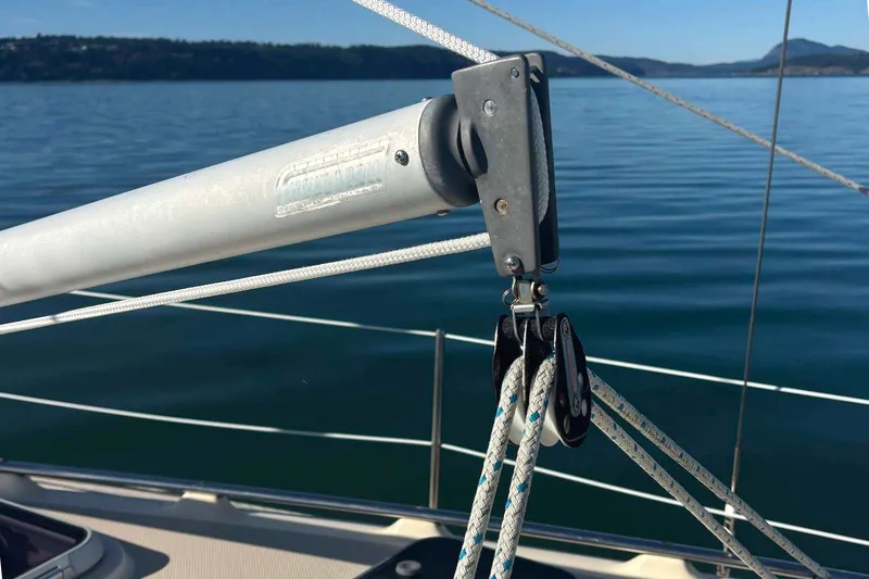 Slide: The Image of Sailboat rigging on 2002 Island Packet 350, calm waters in the background. - 16