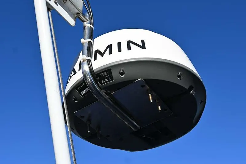 Slide: The Image of Garmin radar on 2002 Island Packet 350 sailboat against clear blue sky. - 93