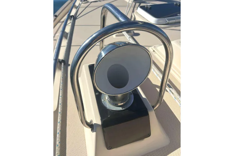 Slide: The Image of Deck detail of a 2002 Island Packet 350 sailboat, featuring a chrome fitting. - 18