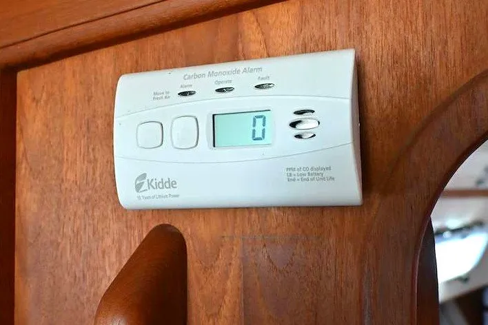 Slide: The Image of Carbon monoxide alarm on 2002 Island Packet 350 yacht interior wood panel. - 51