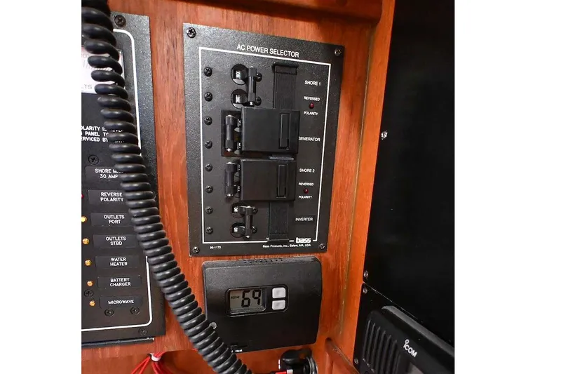 Slide: The Image of AC power selector panel on a 2002 Island Packet 350 yacht. - 38