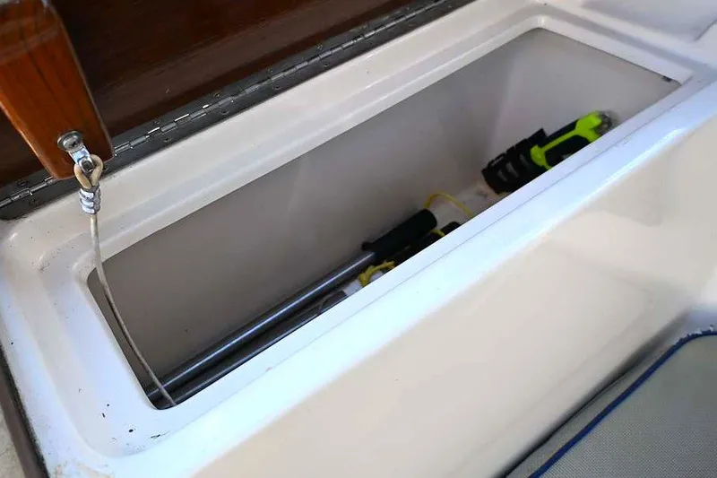 Slide: The Image of Storage compartment on a 2002 Island Packet 350 sailboat, containing tools and equipment. - 85